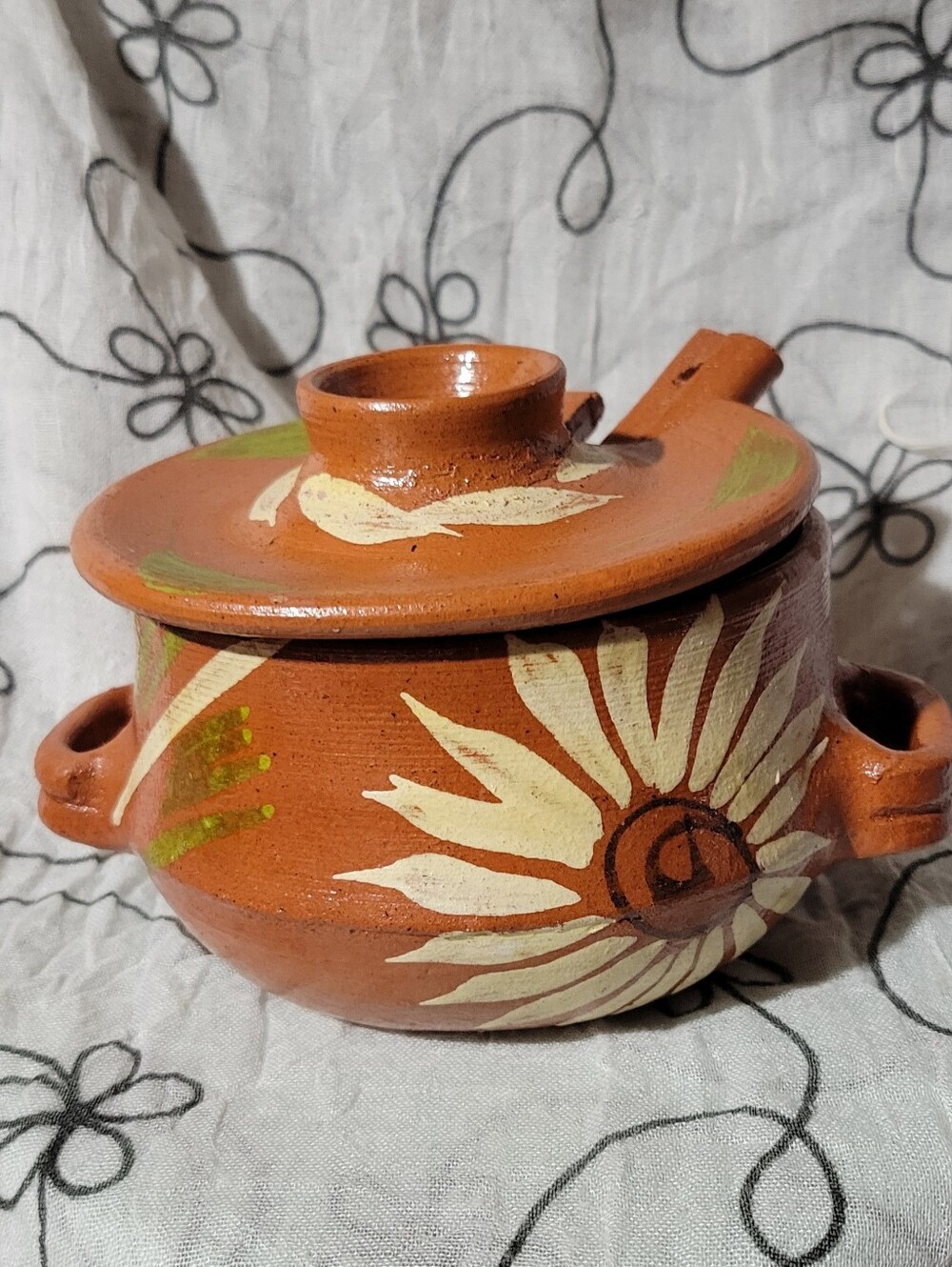 Vintage Rustic hand-painted Mexican red clay pot with a lid and spoon.